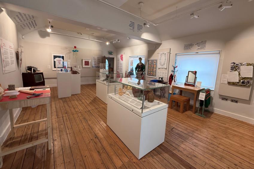 A photo of the From Poland exhibition room, showing all the cases and artifacts on the walls A photo of the From Poland exhibition room, showing all the cases and artifacts on the walls