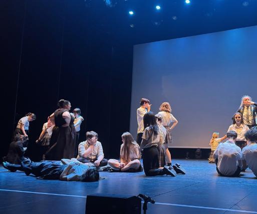 A class of secondary school children wearing uniform perform on the Newark Palace Theatre stage. A class of secondary school children wearing uniform perform on the Newark Palace Theatre stage.