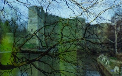 Newark Castle overlaid with a photograph of a bare tree in winter